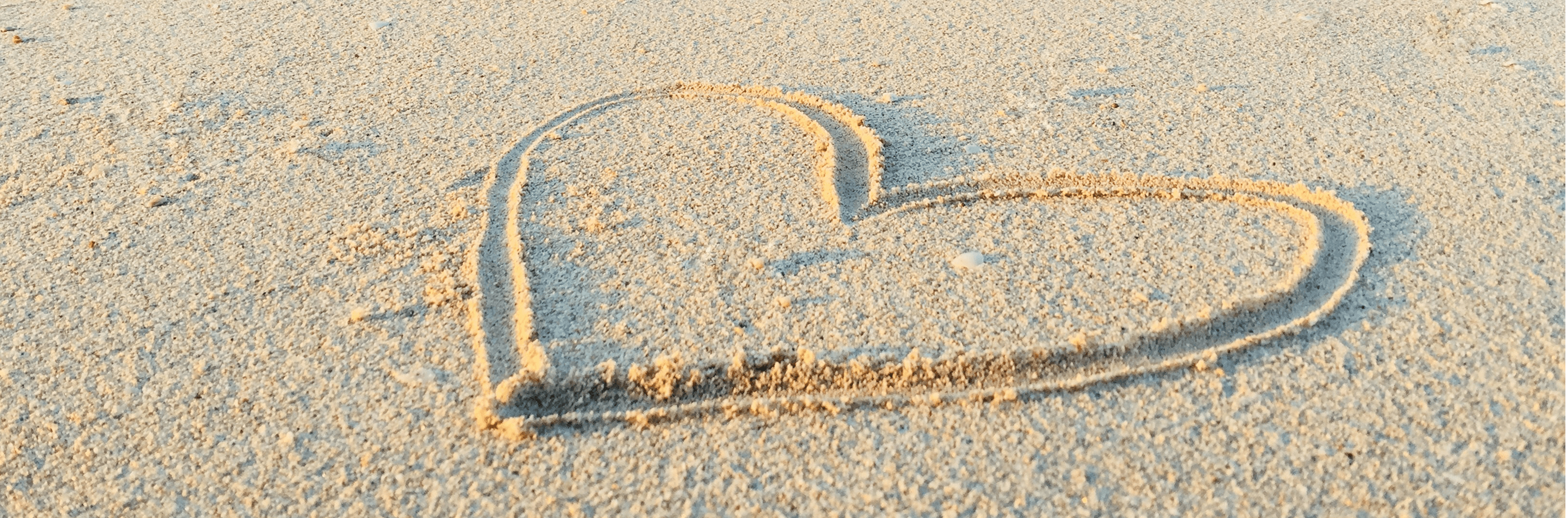 Heart drawn on sand